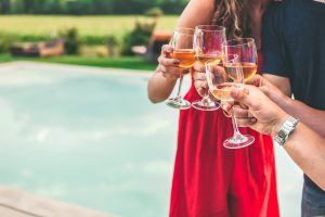 People having drinks by the pool